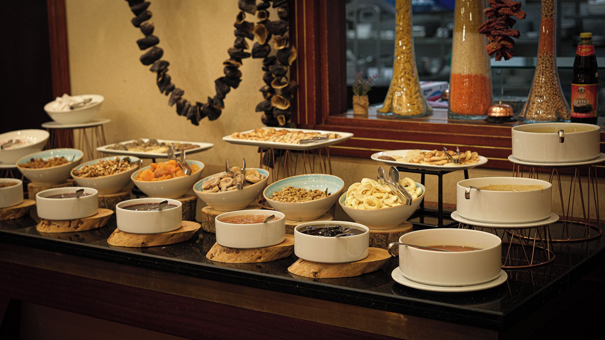 A buffet with various dishes and beverages.