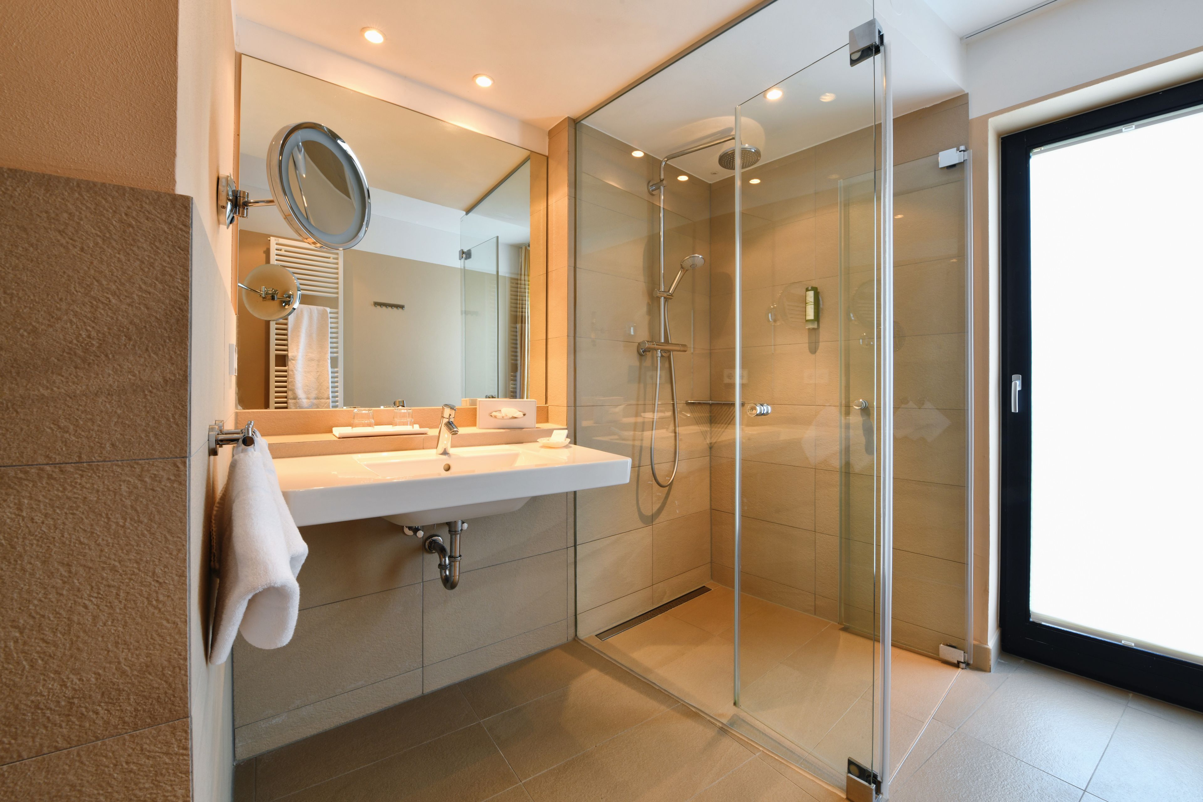 shower, hair dryer, slippers, towels