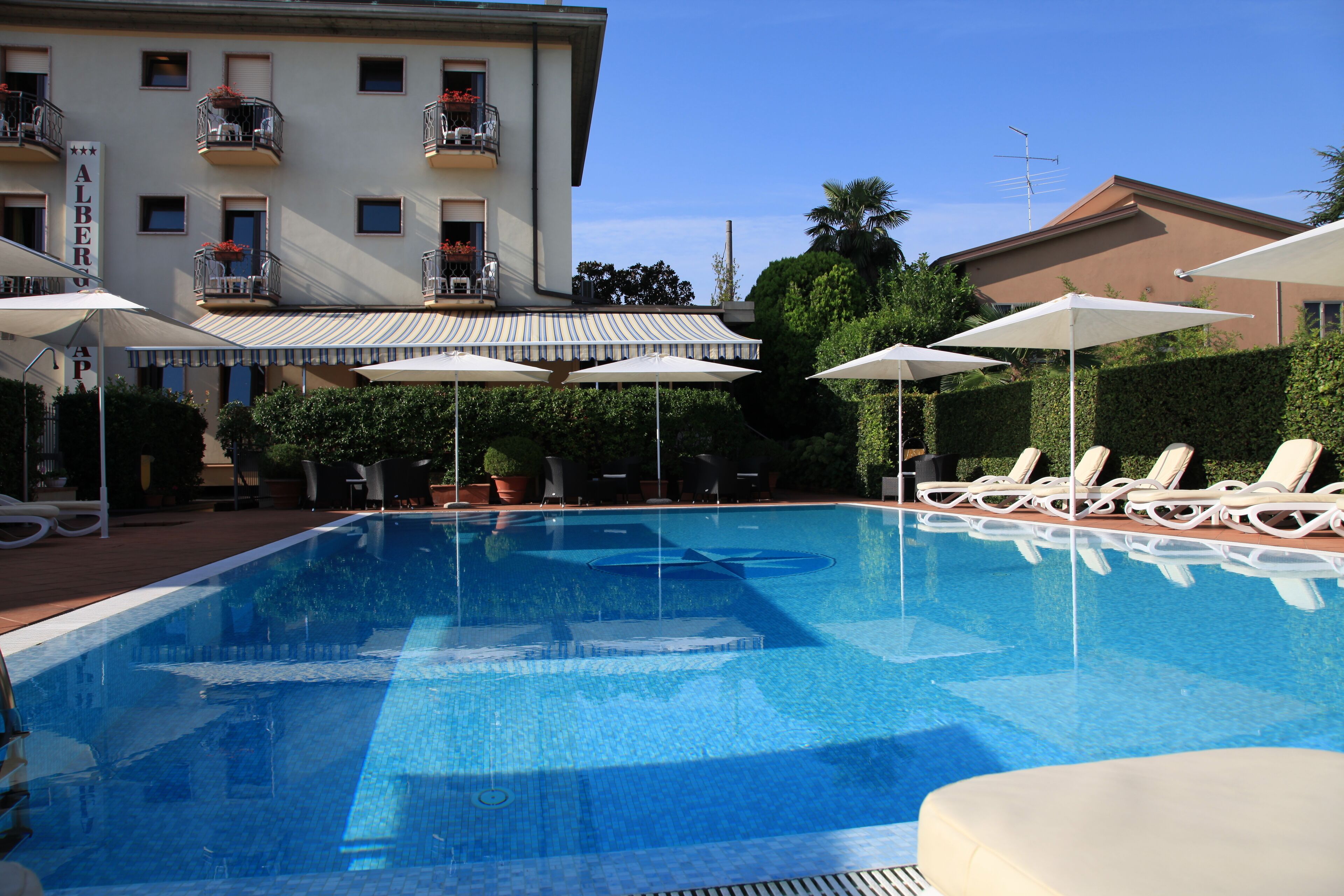 seasonal outdoor pool, open 9:00 am to 7:00 pm, pool umbrellas