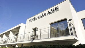 A modern hotel building with the name "HOTEL VILLA AZUR" prominently displayed. - Hotel Villa Azur (Villeneuve-Loubet)