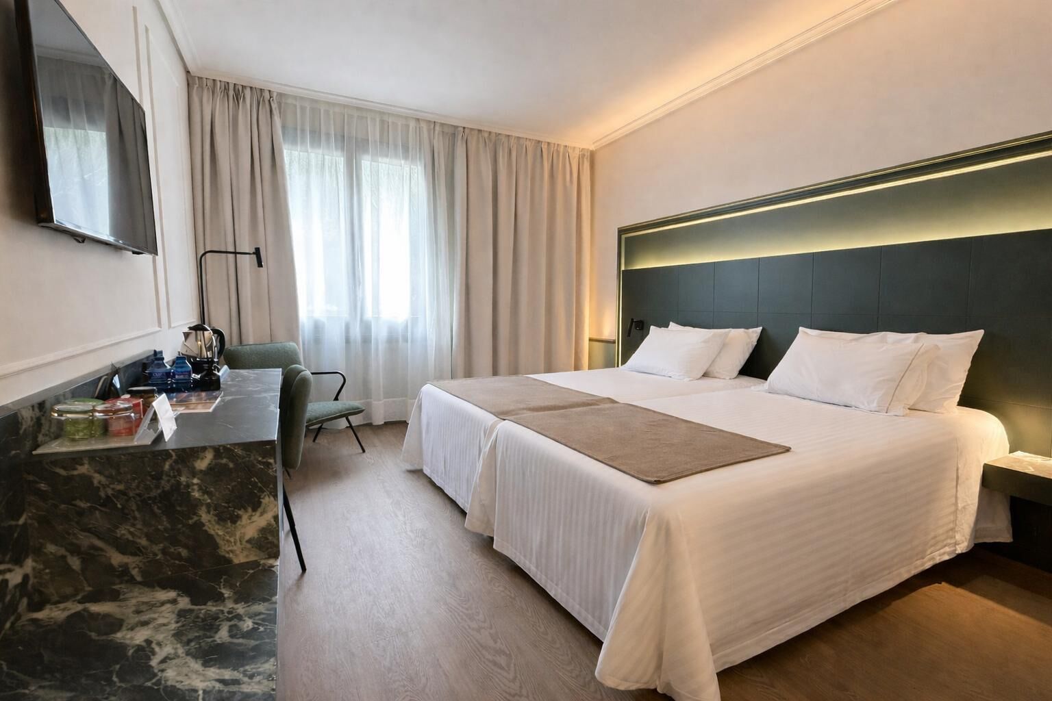 Minibar, desk, laptop workspace, iron/ironing board