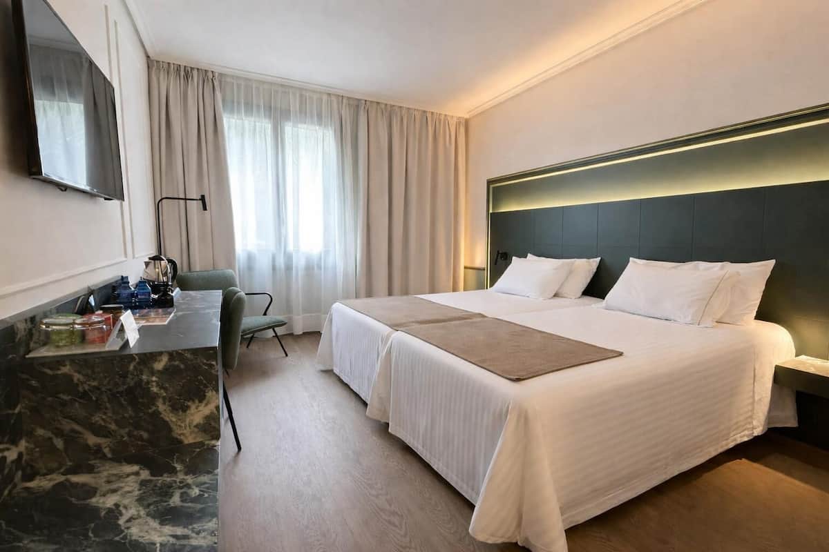 Minibar, desk, laptop workspace, iron/ironing board