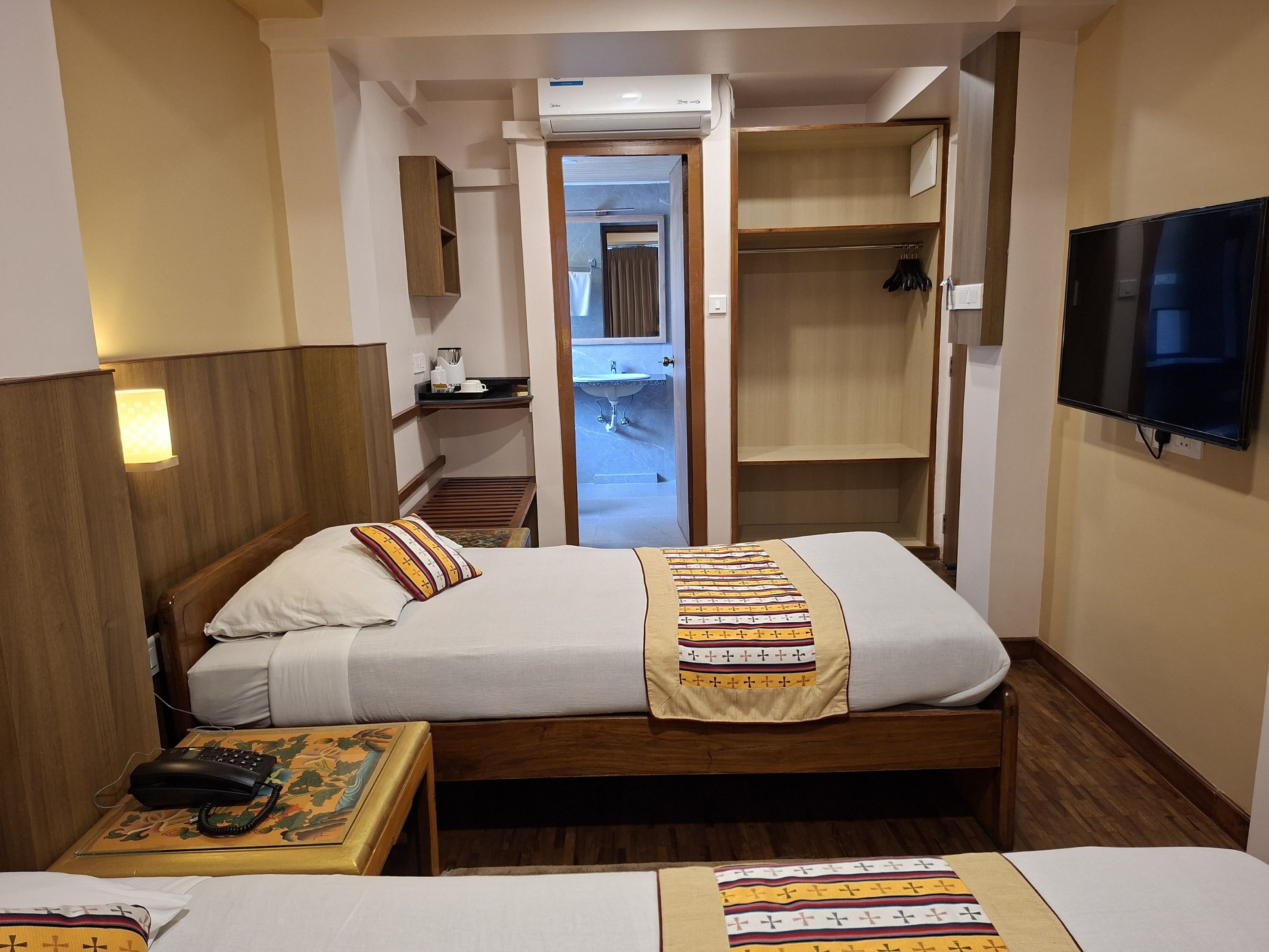 Habitación doble Deluxe | Ropa de cama de alta calidad y edredón 