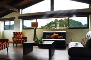 Penthouse, 2 Bedrooms | Living room | Flat-screen TV