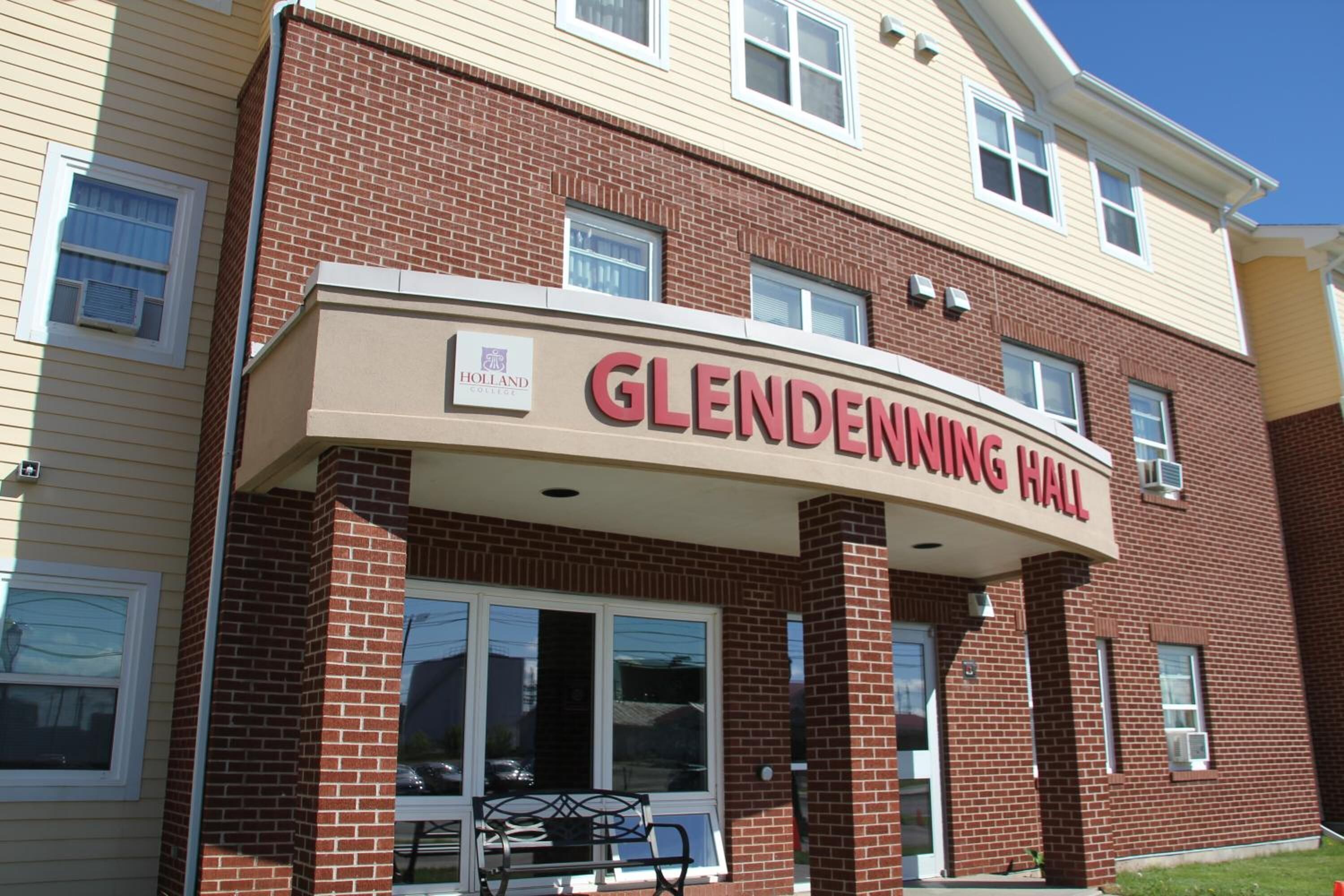 A brick building with a sign reading "Glendenning Hall."