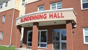 A brick building with a sign reading "Glendenning Hall." - Glendenning Hall (Charlottetown)