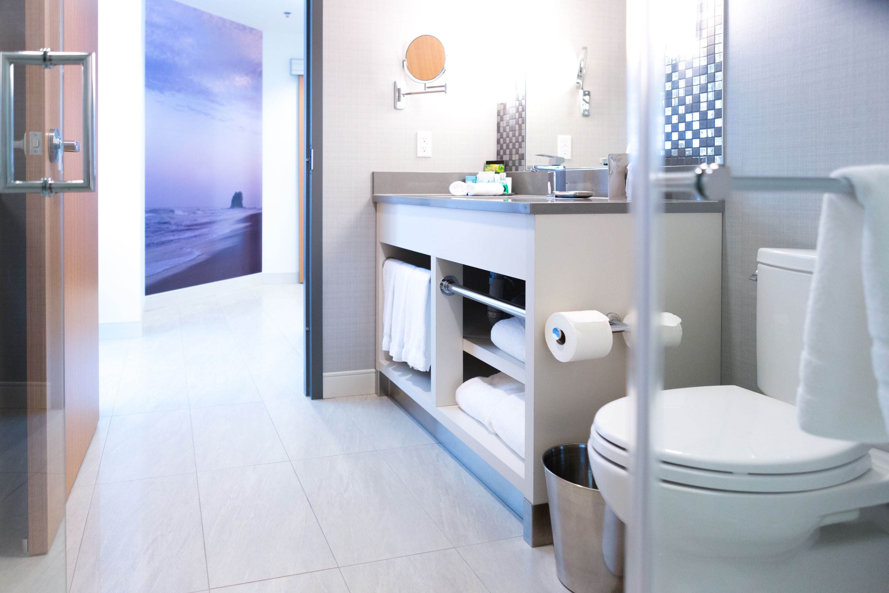 designer toiletries, hair dryer, towels