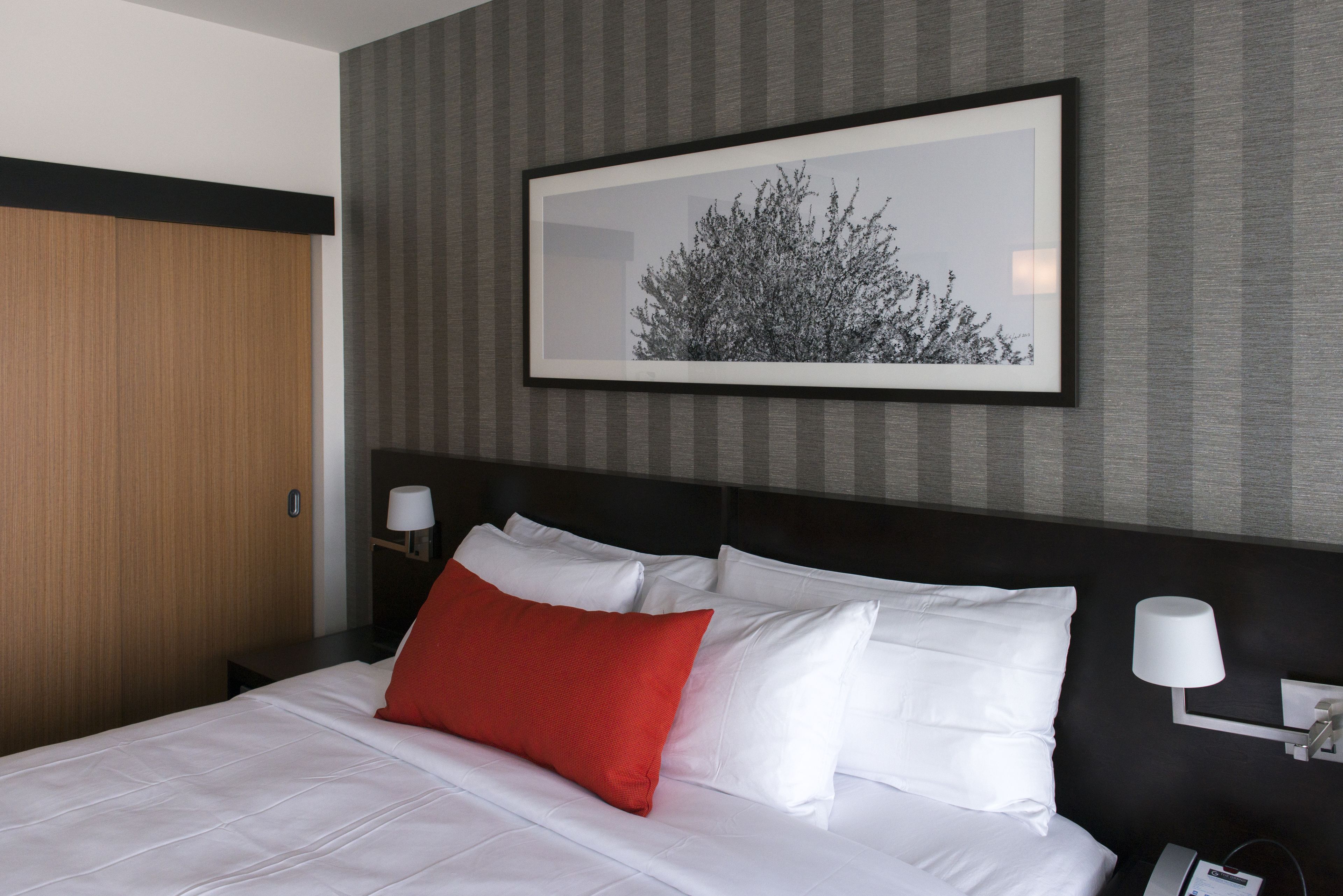 deluxe room, 1 king bed | premium bedding, pillow-top beds, in-room safe, desk