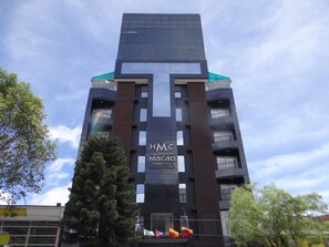 A modern hotel building with a prominent 'HMC Hotel Macao Colombo' sign. - Hotel Macao Colombia (Bogotá)