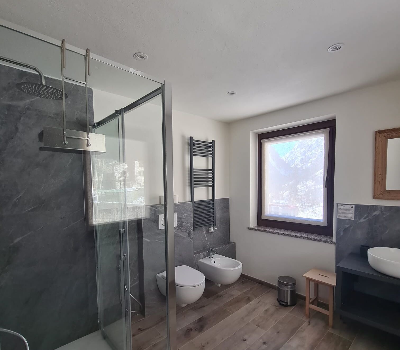 panoramic suite | bathroom | shower, hair dryer, slippers, bidet