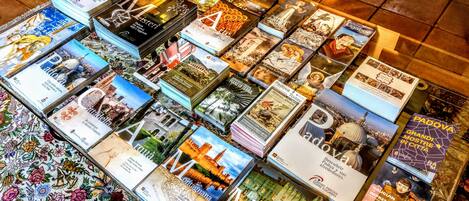 A table with various travel brochures and books.