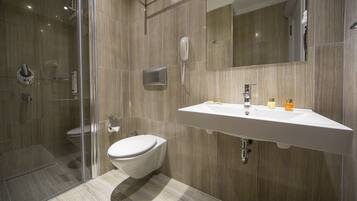 Shower, free toiletries, hair dryer, slippers