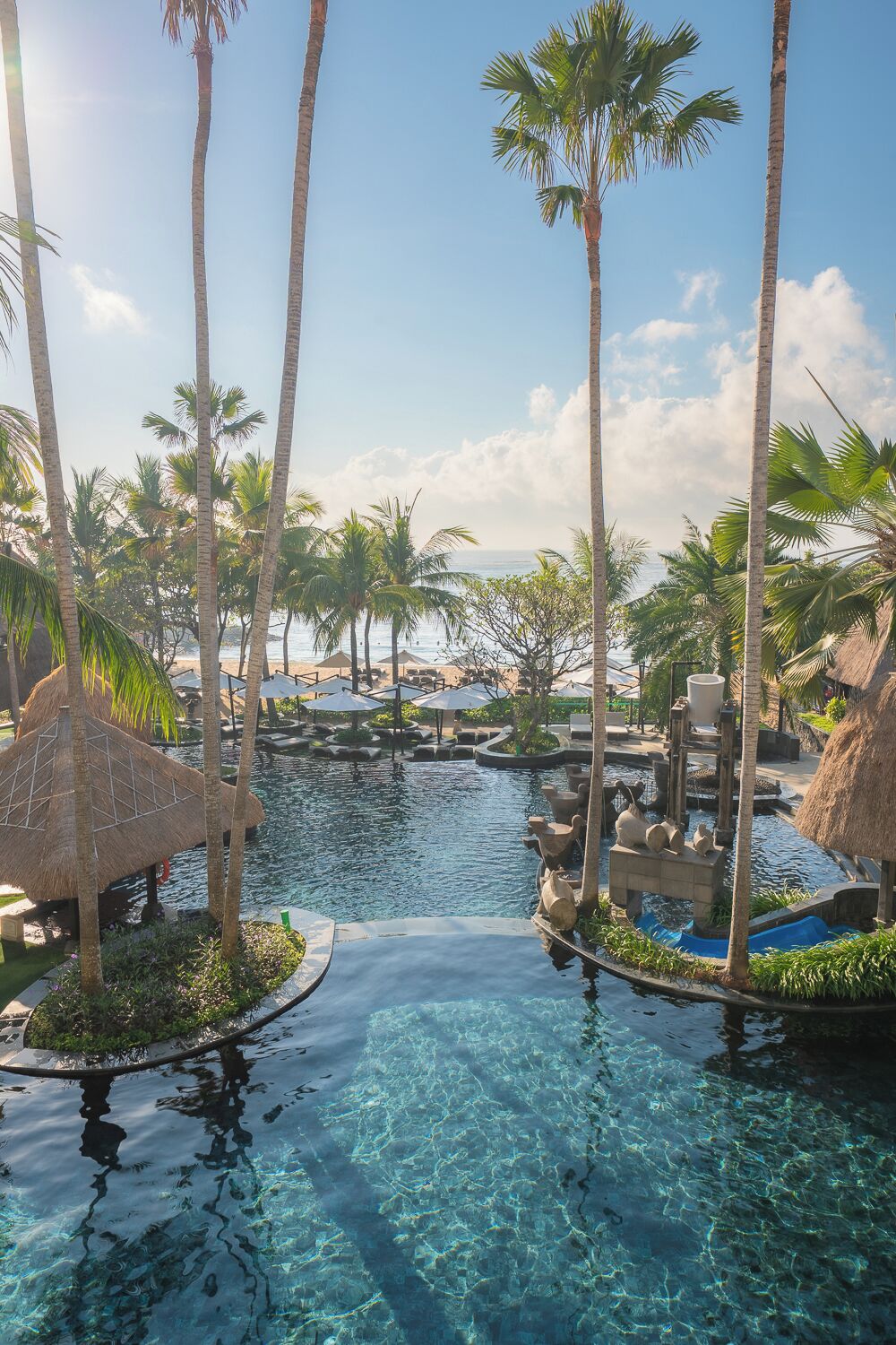 4 outdoor pools, open 8:00 AM to 8:00 PM, pool umbrellas, pool loungers