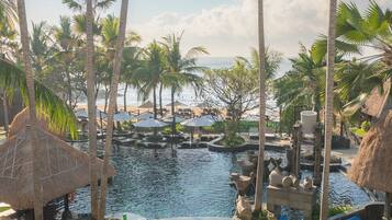 4 outdoor pools, open 8:00 AM to 8:00 PM, pool umbrellas, pool loungers