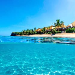 On the beach, white sand, sun loungers, beach umbrellas