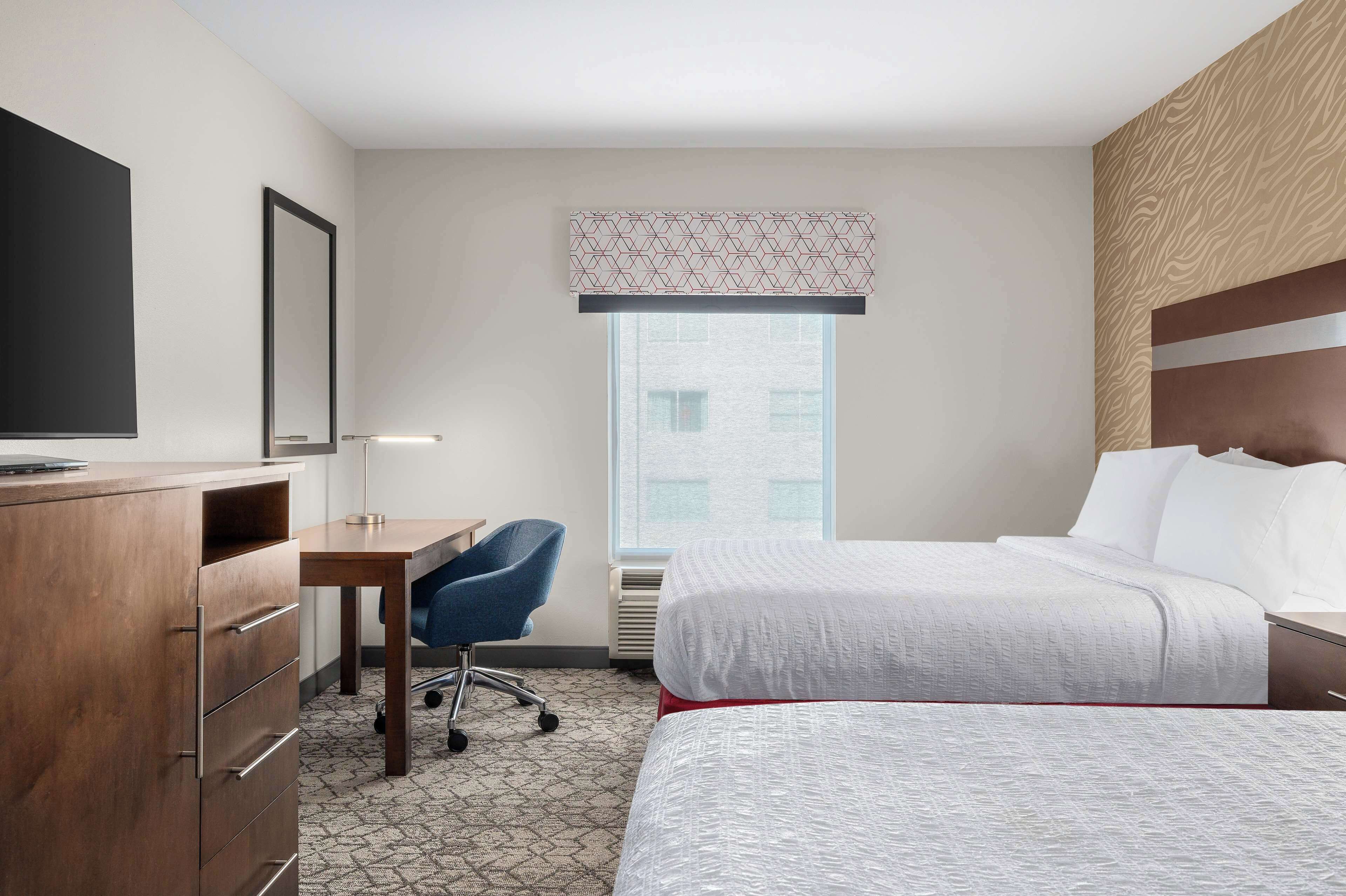 room, 2 queen beds | desk, blackout curtains, iron/ironing board, free cots/infant beds