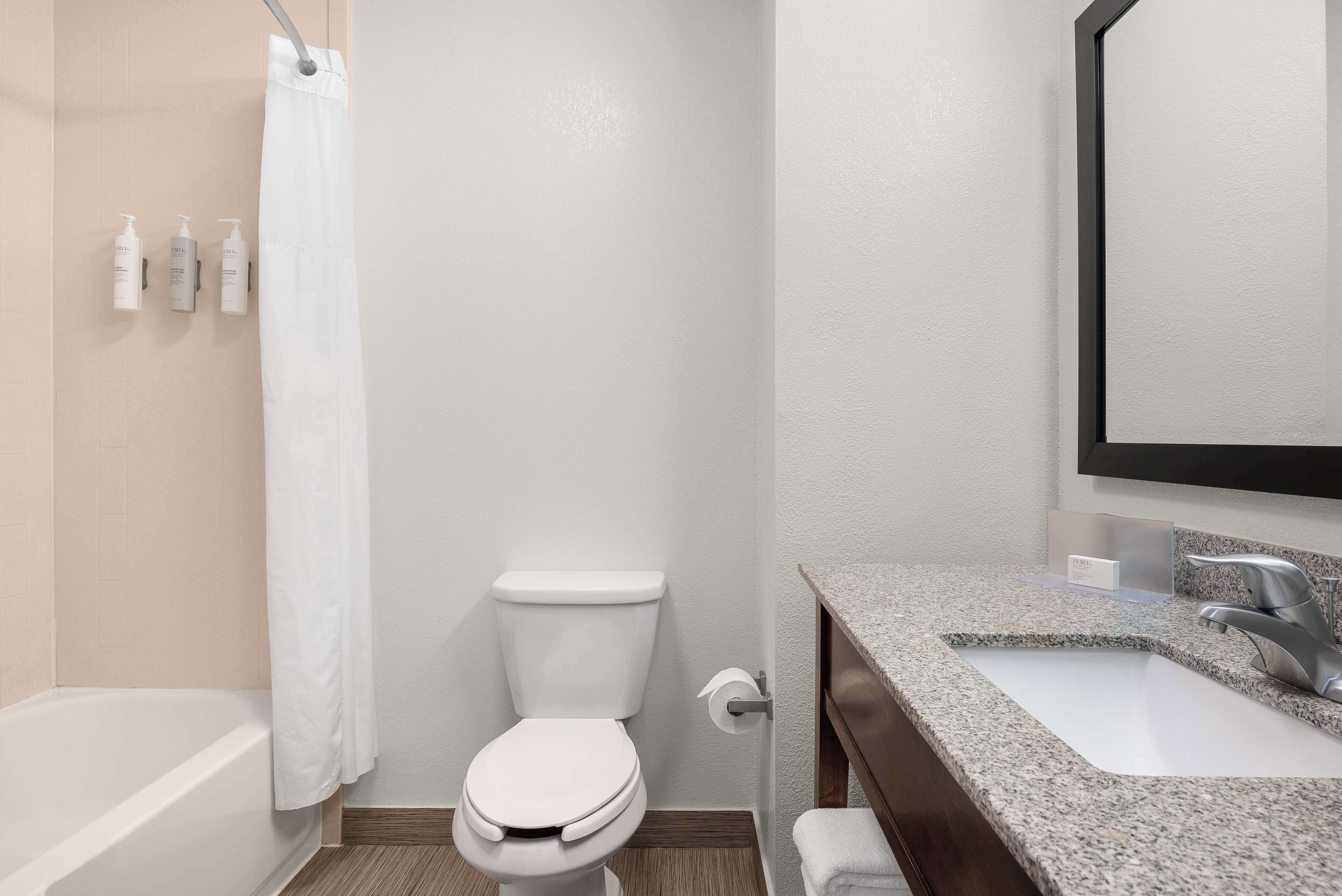 room, 2 queen beds | bathroom | free toiletries, hair dryer, towels