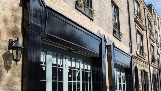 A brick building with large windows and outdoor seating. - Hotel du Vin & Bistro Cambridge (Cambridge)