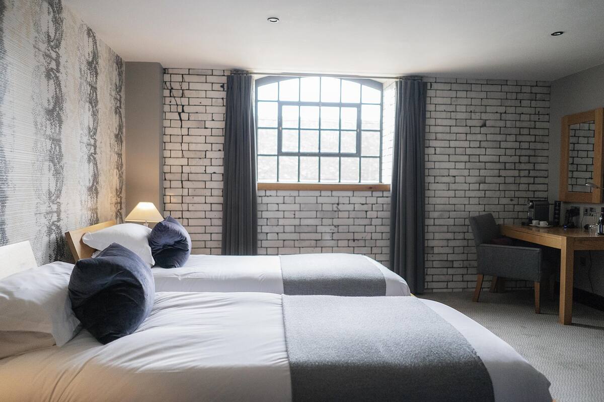 deluxe twin room | egyptian cotton sheets, premium bedding, desk, blackout curtains