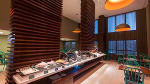 A buffet setup with various food items and a coffee station. - Mais Hotel Aeroporto Salvador (Lauro de Freitas)