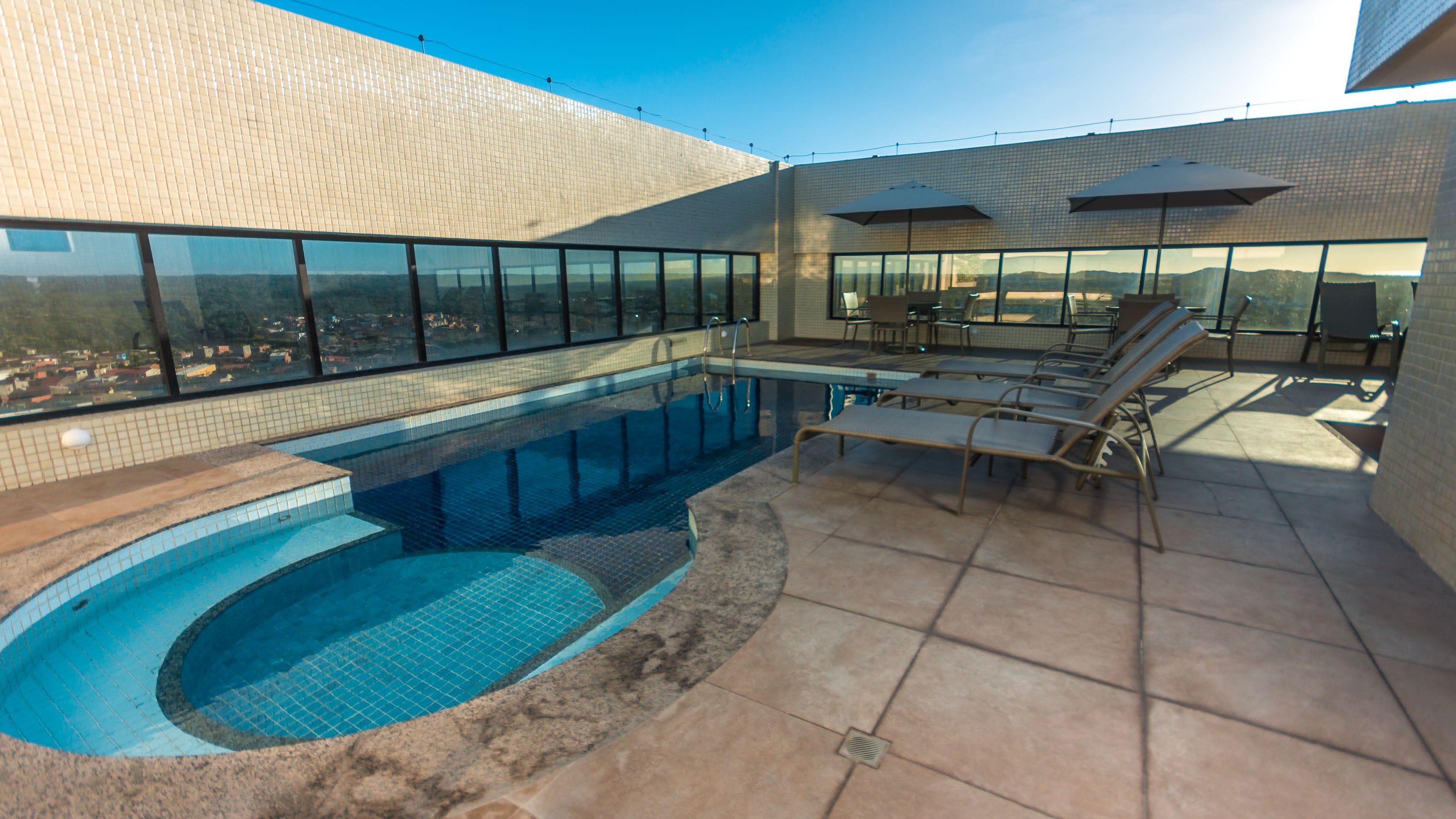 outdoor pool, pool umbrellas, pool loungers