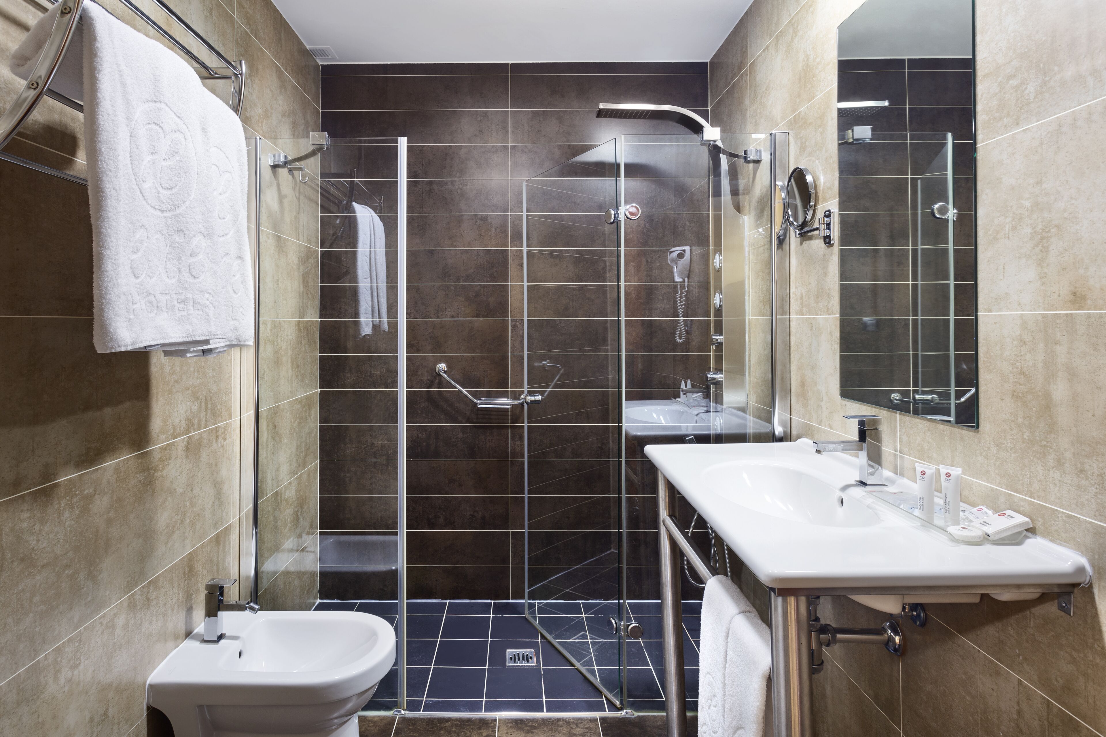 shower, eco-friendly toiletries, hair dryer, towels