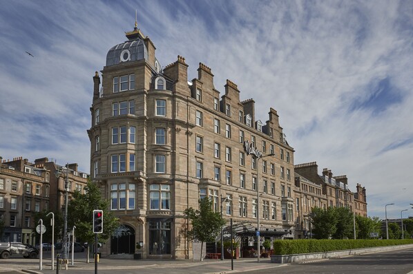 A historic building with a corner entrance, large windows, and a prominent dome. - Malmaison Dundee (Dundee)