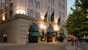 A large, historic building with multiple floors, arched windows, and a prominent dome on the top. - Malmaison Newcastle (Newcastle-upon-Tyne)