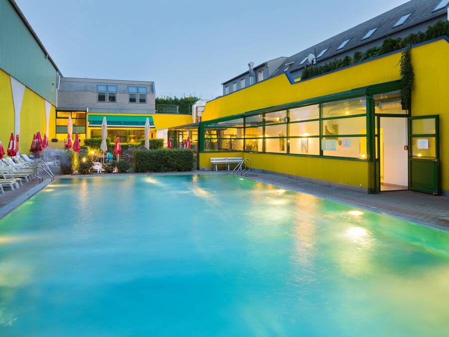 Seasonal outdoor pool, open 8 AM to 10 PM, pool umbrellas, pool loungers