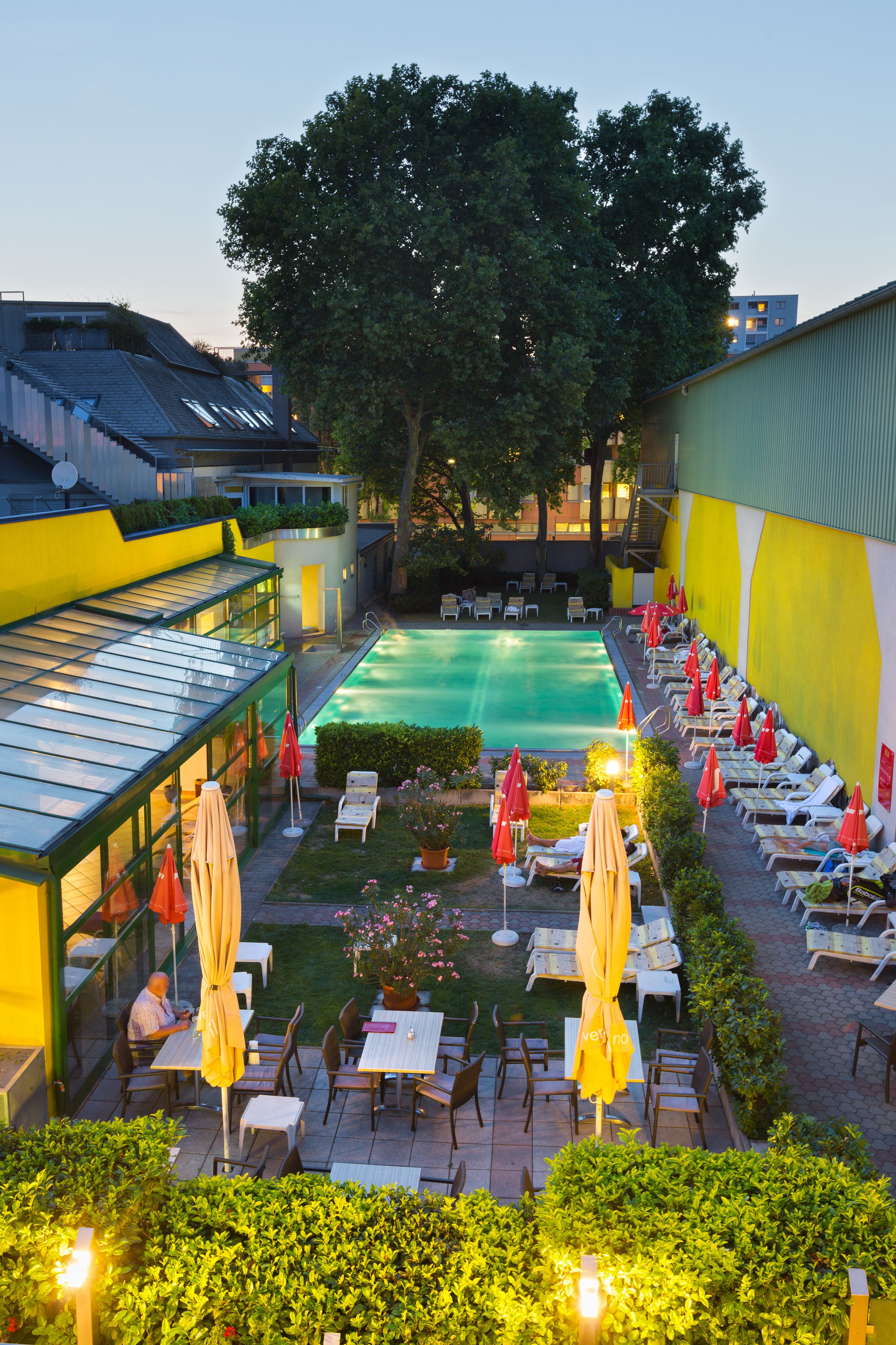 seasonal outdoor pool, open 8 am to 10 pm, pool umbrellas, pool loungers