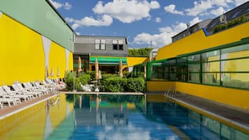Seasonal outdoor pool, open 8 AM to 10 PM, pool umbrellas, pool loungers