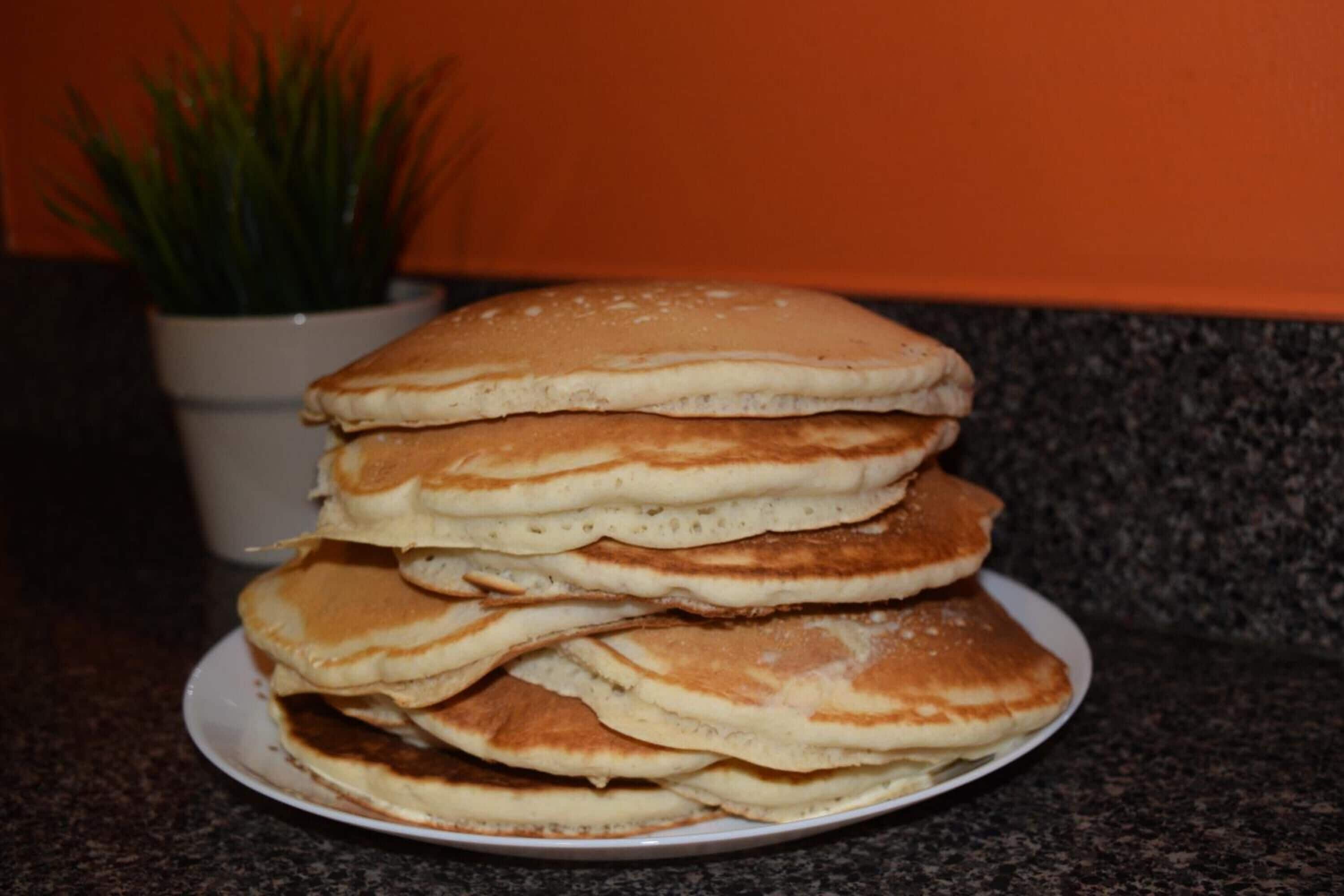 A stack of pancakes on a plate.