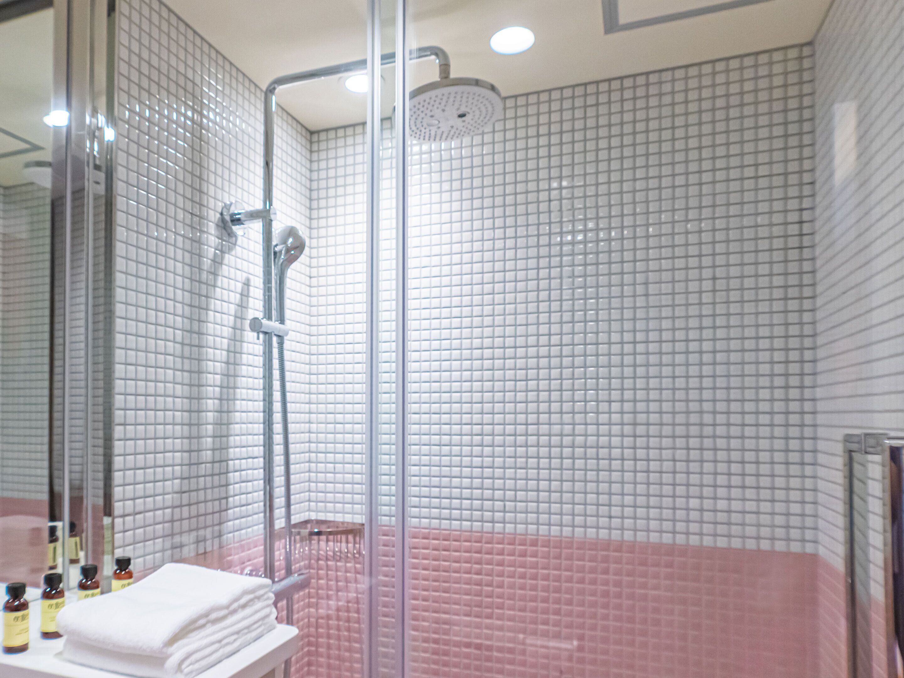 Shower, designer toiletries, hair dryer, bathrobes