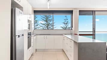 One Bedroom Ocean View Apartment | Private kitchen | Full-size fridge, microwave, oven, stovetop