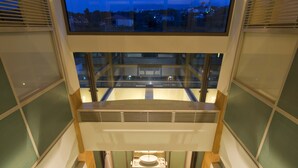 A multi-level interior with a staircase leading to a lower floor. - Conte Marino Villas (Platanias)