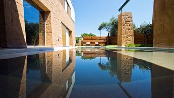 2 outdoor pools, pool umbrellas, pool loungers