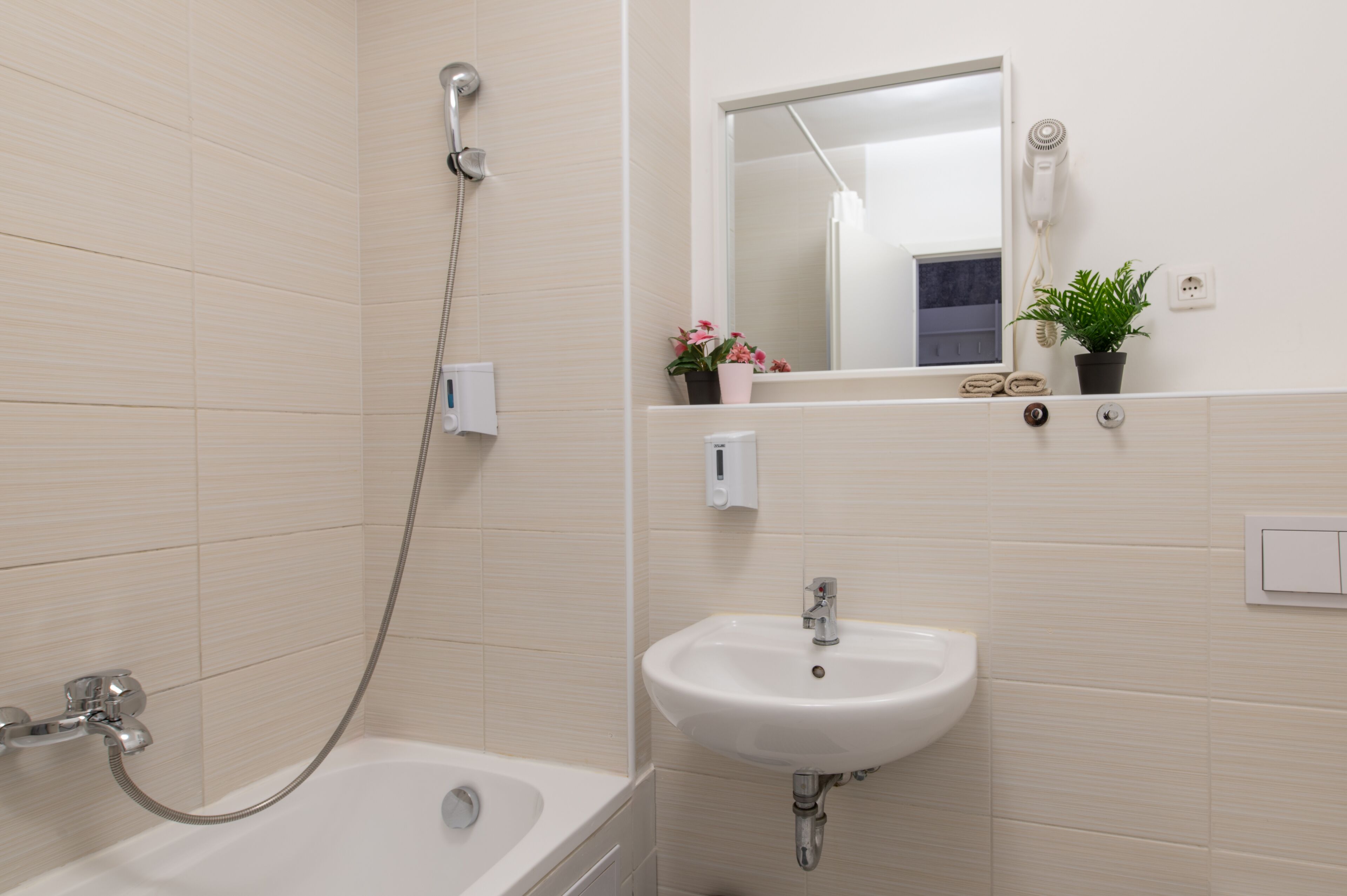 studio with garden view | bathroom | combined shower/bathtub, hair dryer, towels