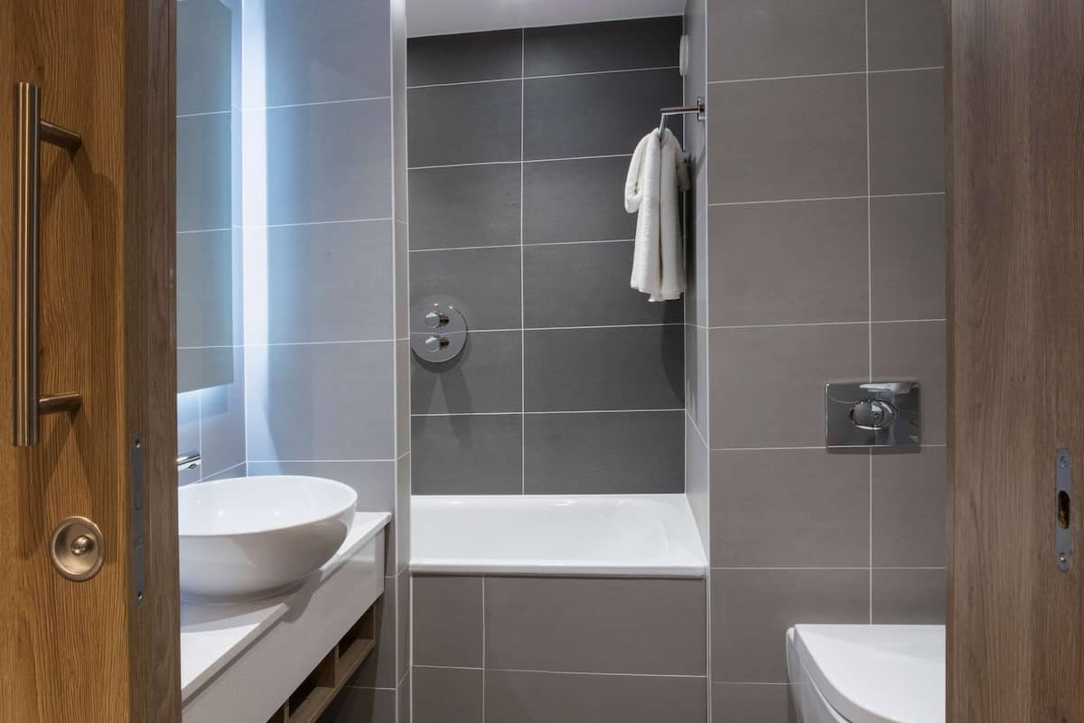 designer toiletries, hair dryer, bathrobes, towels