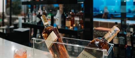 A bar area with bottles of Johnnie Walker Gold Label Reserve on display.