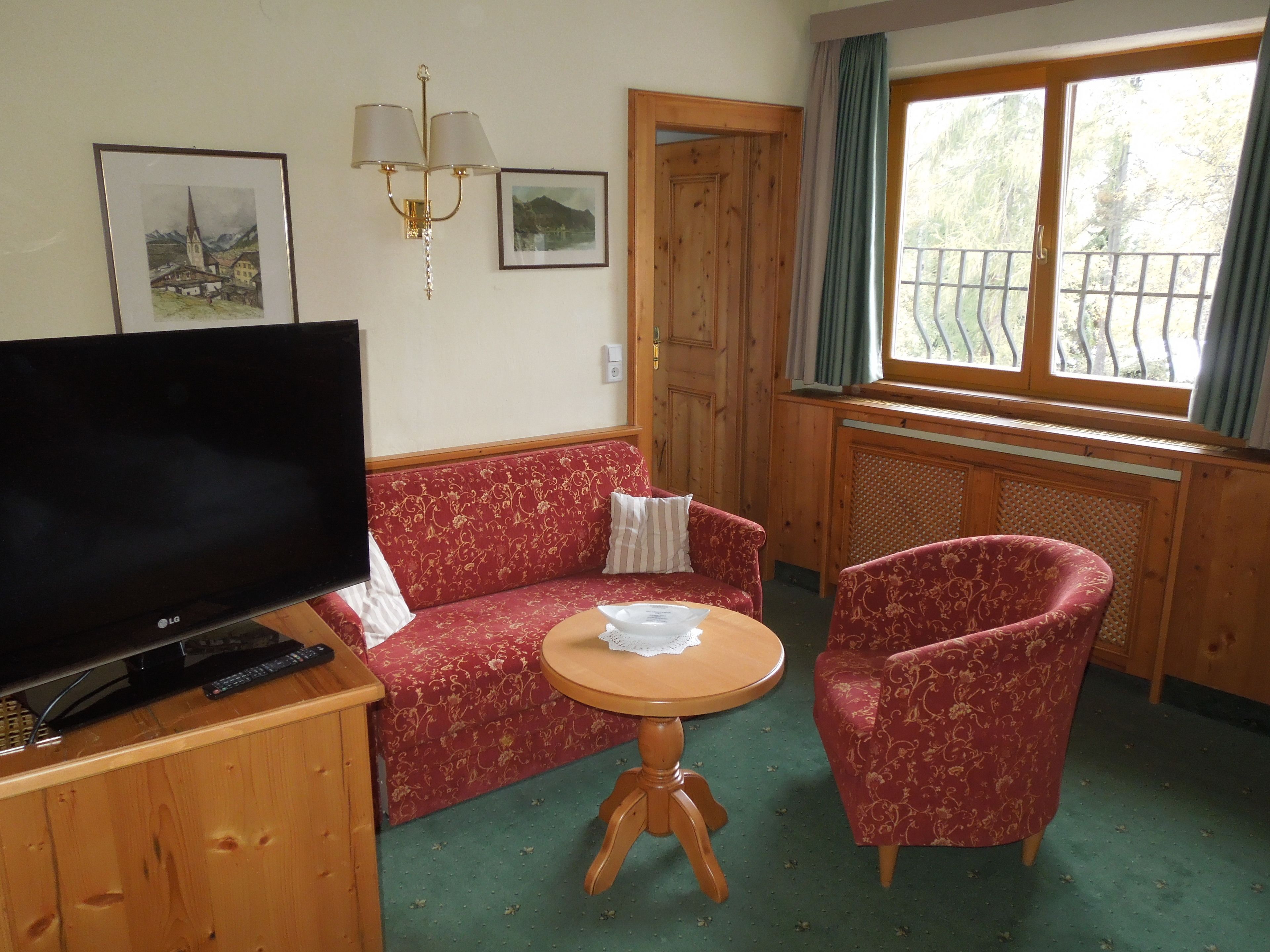 economy double room, 1 queen bed | living area | tv