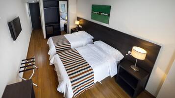 Standard Twin Room | Minibar, in-room safe, desk, soundproofing