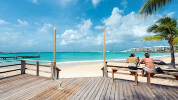 Beach nearby, white sand, beach towels