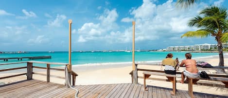 Beach nearby, white sand, beach towels