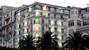A multi-story building with balconies, the name "HOTEL ALBERT" visible, and palm trees in the foreground. - Albert Premier (Algiers)