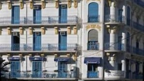 A multi-story building with balconies and a classical architectural style. - Albert Premier (Algiers)
