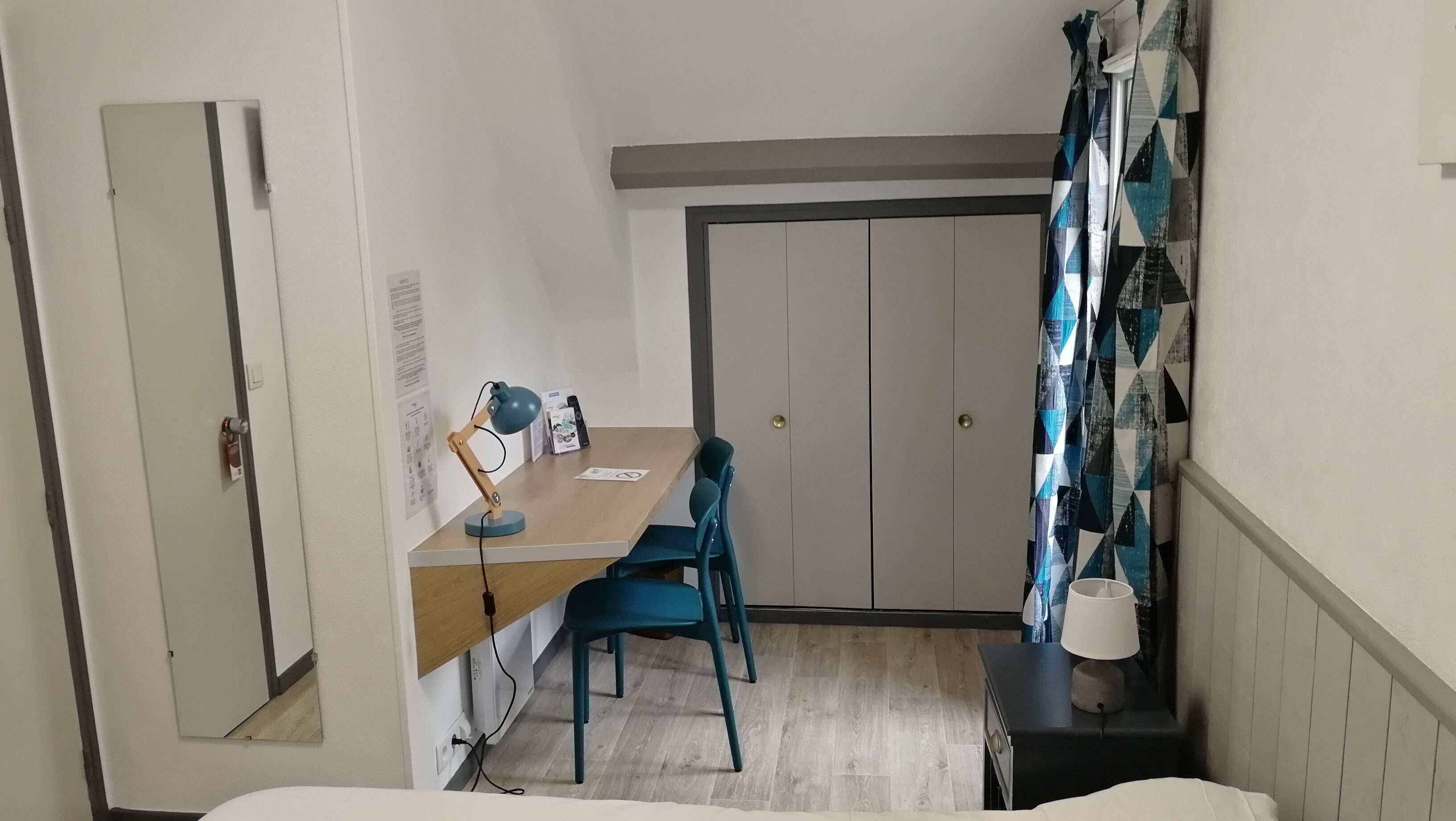 family room | individually decorated, desk, blackout curtains, iron/ironing board