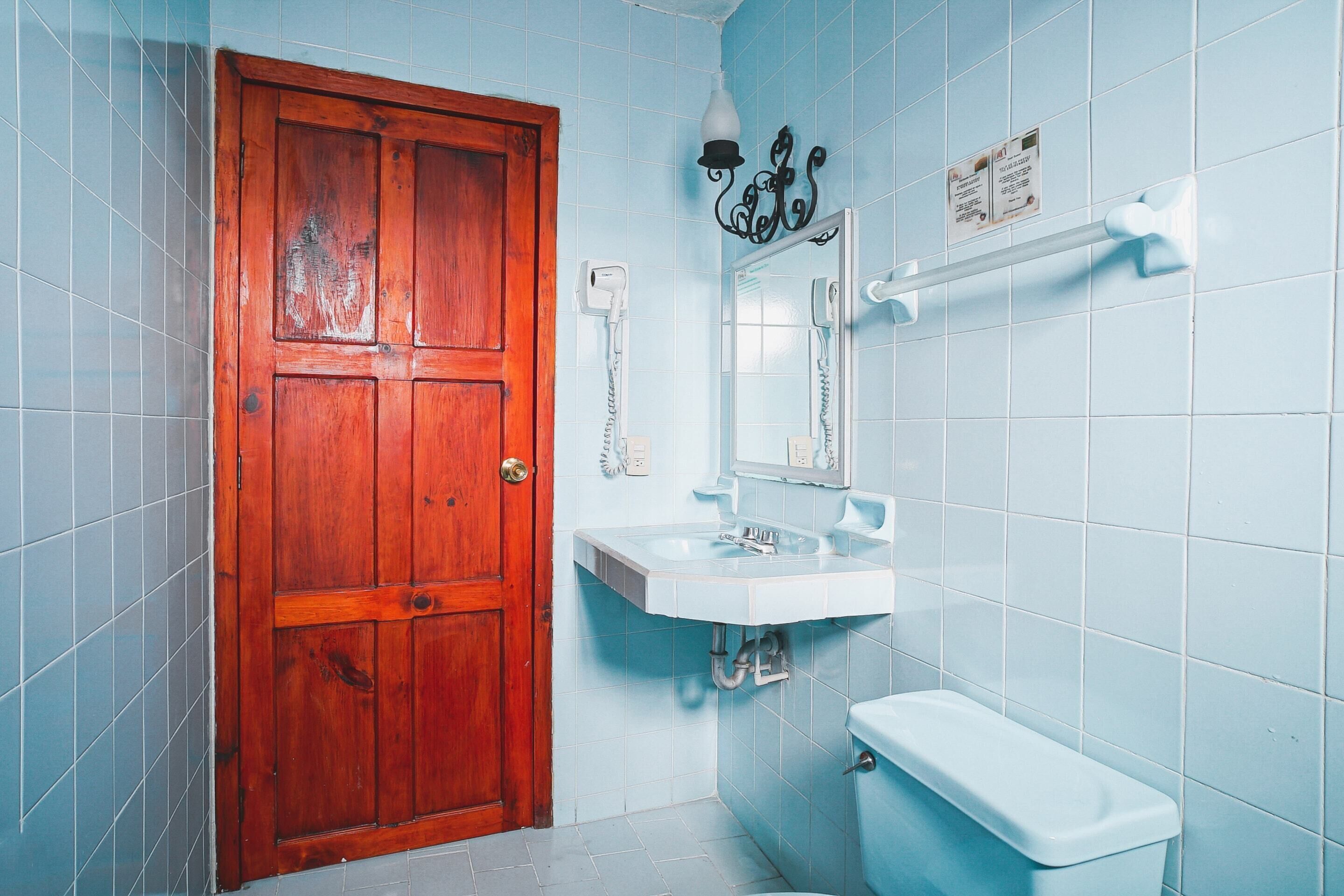 standard triple room | bathroom | shower, towels, soap, shampoo