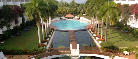 Outdoor pool, open 7 AM to 7 PM, pool umbrellas, sun loungers