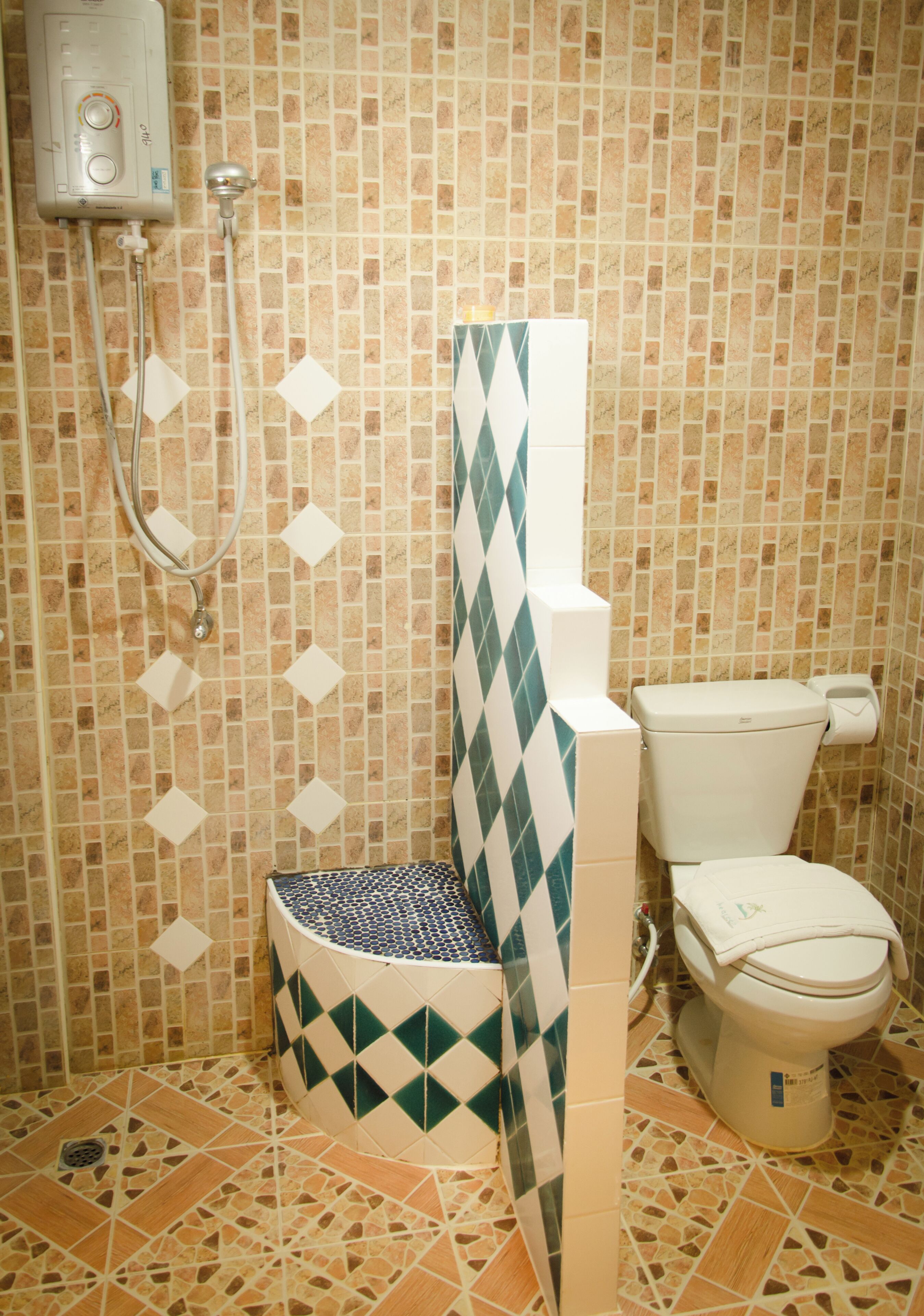 deluxe room, pool view | bathroom | shower, hair dryer, bidet, towels