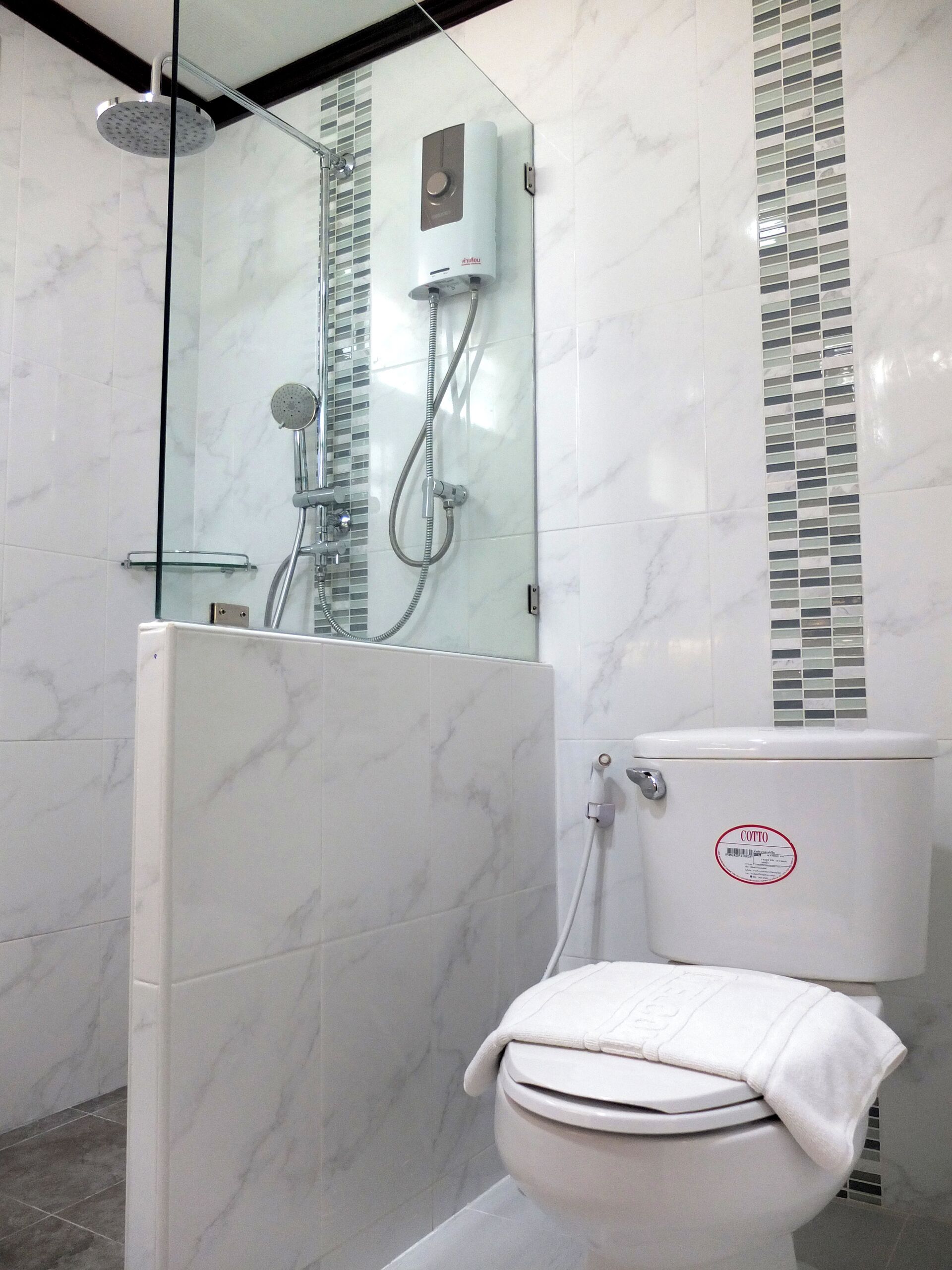 deluxe villa | bathroom | shower, hair dryer, bidet, towels